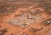 FILE- An aerial view shows a camp of internally displaced people in Djibo, Burkina Faso, May 26, 2022. Burkina Faso's government says more than 2 million people have become internally displaced, fueling a dire humanitarian crisis across the conflict-ridden country. The number of displaced people has mushroomed by more than 2,000% since 2019, when violence linked to al-Qaida and the Islamic State group began surging and spreading across the West African nation. (AP Photo/Sam Mednick, File)