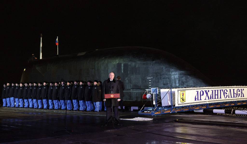 In this pool photograph distributed by the Russian state agency Sputnik, Russia's President Vladimir Putin attends a video-linked ceremony to launch the Project 885M Yasen-M nuclear-powered submarine Perm, in the Arctic Circle port city of Murmansk on March 27, 2025. (Photo by Gavriil Grigorov / POOL / AFP)