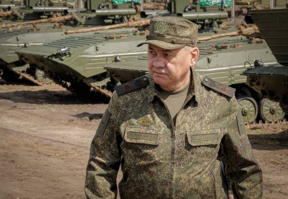 This photo taken and released by Russian Defense Ministry Press Service on Thursday, June 8, 2023, Russian Defense Minister Sergei Shoigu inspects the preparation of equipment and weapons for shipment to the zone of the special military operation at the arsenals and storage bases of the Western Military District at an undisclosed location in Russia. (Russian Defense Ministry Press Service via AP)