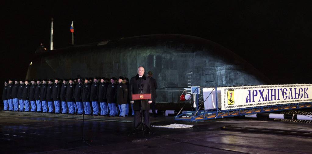In this pool photograph distributed by the Russian state agency Sputnik, Russia's President Vladimir Putin attends a video-linked ceremony to launch the Project 885M Yasen-M nuclear-powered submarine Perm, in the Arctic Circle port city of Murmansk on March 27, 2025. (Photo by Gavriil Grigorov / POOL / AFP)